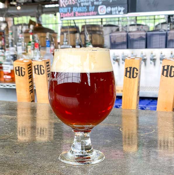 Red sour beer in a glass at Hunter-Gatherer Brewery in Columbia, SC