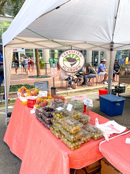 Produce vendor booth at Soda City Market in Columbia, SC