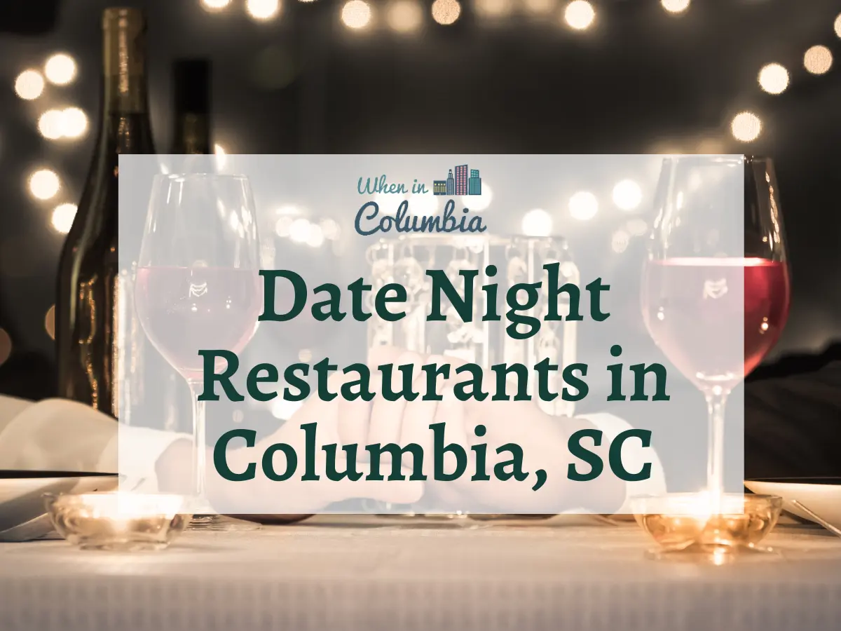 Couple holding hands with wine glasses and bistro lights with text "Date Night Restaurants in Columbia, SC"