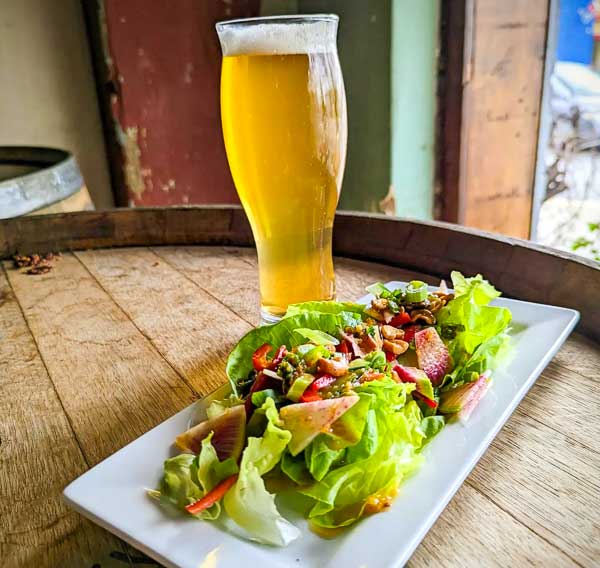 Salad and beer at Hunter-Gatherer brewery in downtown Columbia